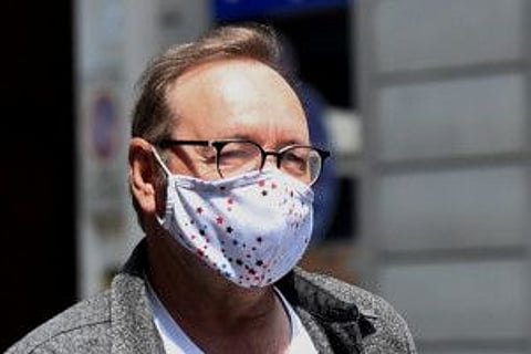 Actor Kevin Spacey walks down Carlo Alberto street as he visits the city, where he is expected to return for a cameo appearance in a low budget Italian film, after largely disappearing from public view, in Turin, Italy, June 1, 2021.