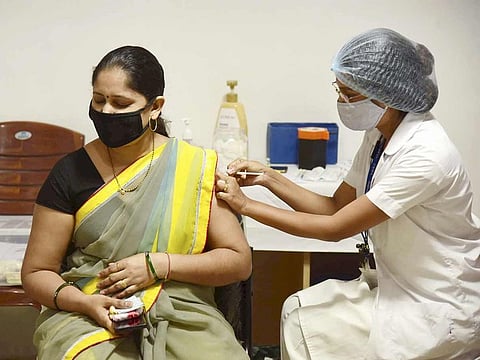 A medic administers COVID-19 vaccine to a beneficiary in the age group of 30 to 44, during a special vaccination camp at ESIS Hospital, in Navi Mumbai, on June 19, 2021.