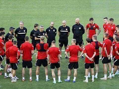 Poland's manager Paulo Sousa speaks to his players during training session at the La Cartuja stadium in Seville, Spain ahead of their game against Spain in Group E today.