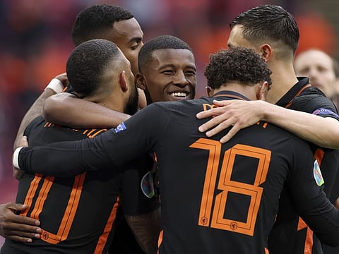 Georginio Wijnaldum of the Netherlands (centre) celebrates after scoring his side's second goal during the Euro 2020 championship Group F match against North Macedonia at the Johan Cruyff Arena in Amsterdam, Netherlands
