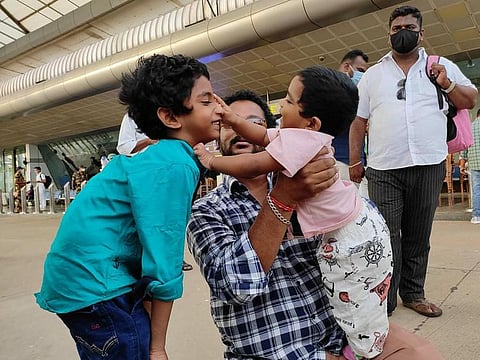 Devesh with his father and brother upon arrival.
