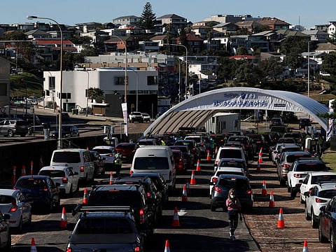 Vehicles wait in line at the Bondi Beach drive-through COVID-19 testing centre in the wake of new positive cases in Sydney on June 17, 2021.