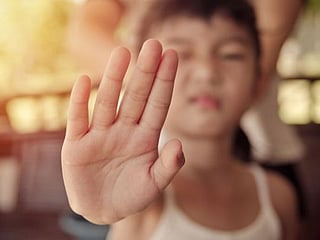 Why you should never force kids to kiss family members