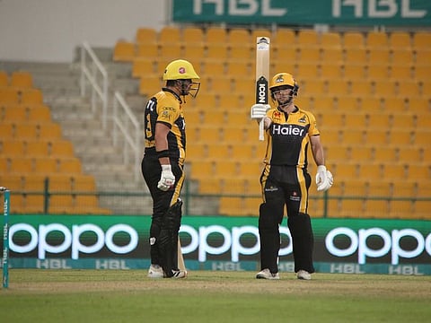 Peshawar Zalmi's Hazratullah Zazai and Jonathan Wells during their match-winning partnership in the second Qualifier on Tuesday.