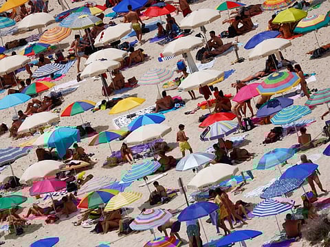 People on a beach on the Sicilian island of Lampedusa, Italy, on June 22, 2021. The growing threat of the delta coronavirus variant in the European Union has prompted a fresh warning from the bloc's disease prevention agency about the pace of vaccinations and not rushing reopenings.