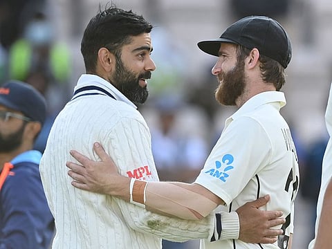India's Virat Kohli (left) congratulates New Zealand's captain Kane Williamson on the final day of the ICC World Test Championship final at the Ageas Bowl in Southampton, southwest England, on June 23, 2021. New Zealand beat India by 8 wickets.