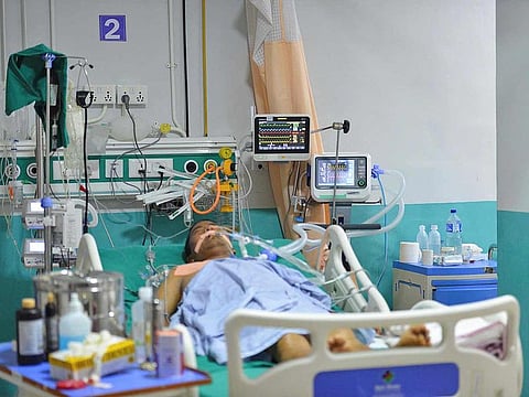 A COVID-19 patient is seen on a ventilator at Karuna Hospital, which rents ventilators from the non-profit organisation Nepal Ventilator Services, in Kathmandu.