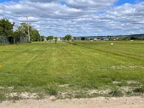 A field near the former Marieval Indian Residential School, where the Cowessess First Nation say they found the unmarked graves of hundreds of people, is seen near Grayson, Saskatchewan, Canada.