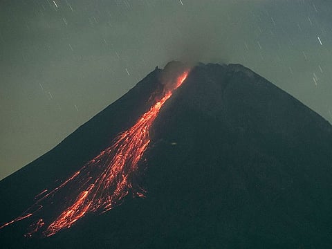 Lava flows from Mount Merapi, Indonesia’s most active volcano, as seen from Sleman in Yogyakarta on June 13, 2021.