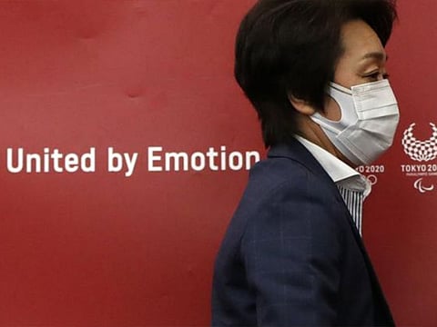 Tokyo 2020 Olympics Organizing Committee President Seiko Hashimoto leaves a news conference after a meeting with local municipalities working group hosted by the government in Tokyo on the day to mark one month to go until the opening of the Olympic Games.