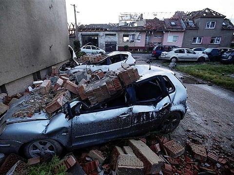 Damaged cars and houses are seen in the aftermath of a rare tornado that struck and destroyed parts of some towns, in the village of Moravska Nova Ves, Czech Republic, on June 25, 2021.