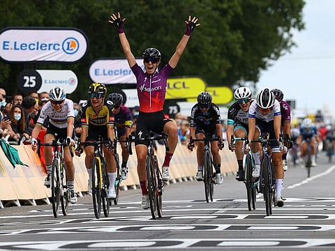 Team SD Worx rider Demi Vollering celebrates as she crosses the finish line during La Course prior to the 1st stage of the 108th edition of the Tour de France