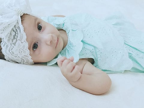 Malak Mohammed Al Alami suffers from spinal muscular atrophy, a rare, progressive, inherited monogenic disease.