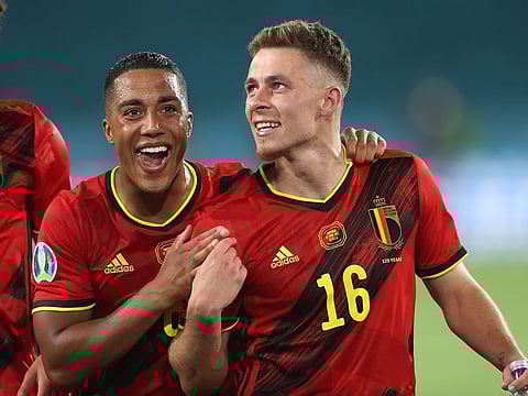 Belgium's Youri Tielemans and Thorgan Hazard celebrate after the match.