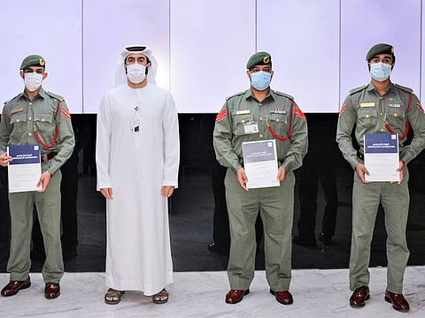 DTC and Dubai Police officials at the ceremony.