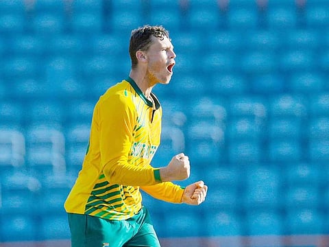 George Linde of South Africa celebrates the dismissal of Andre Russell of West Indies during the 2nd T20I at Grenada National Cricket Stadium, Saint George's, Grenada, on June 27, 2021.