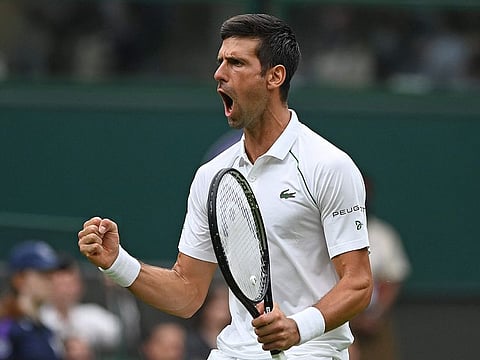 Serbia's Novak Djokovic celebrates going 2-1 up in the fourth set against Britain's Jack Draper during their men's singles first round match on the first day of the 2021 Wimbledon Championships at The All England Tennis Club in Wimbledon, southwest London, on June 28, 2021.
