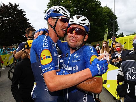 Deceuninck–Quick-Step rider Mark Cavendish celebrates with teammates after winning stage 4 of the 2021 Tour de France