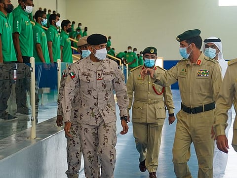 Shaikh Ahmad Bin Tahnoon (left) reviews readiness of National Service Recruits for Expo 2020 Dubai