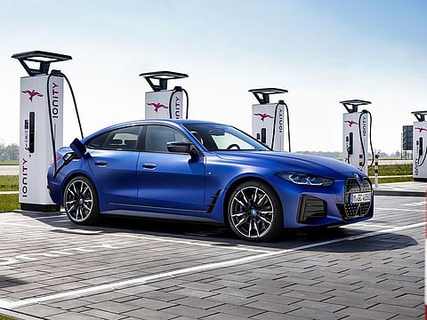 A BMW i4 being charged. A study that calculates the lifetime emissions of vehicles has revealed interesting data.