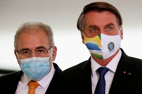 Brazil's Health Minister Marcelo Queiroga and Brazil's President Jair Bolsonaro at the Planalto Palace in Brasilia, Brazil, in a file photo.
