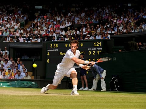 Andy Murray battled back from a two sets to one deficit to defeat German qualifier Oscar Otte and reach the Wimbledon third round yesterday.