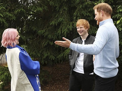 Handout photo issued by WellChild of the Duke of Sussex speaking to Ed Sheeran and Anne-Marie during the WellChild Awards 2021 at a private garden party at Kew Gardens, in London.