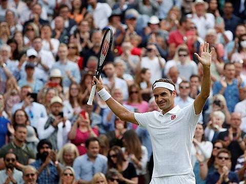 Switzerland's Roger Federer celebrates winning his second round match against France's Richard Gasquet.