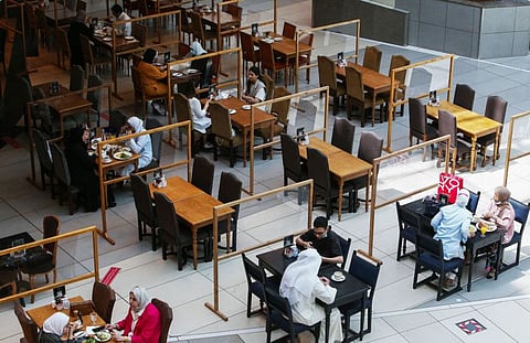 Kuwaitis at a restaurant at The Avenues Mall in Kuwait City, the country's largest shopping centre, on June 27, 2021.