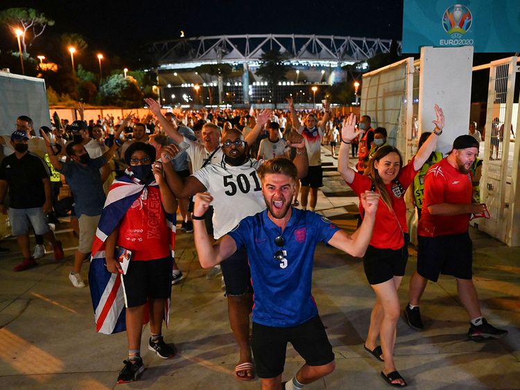 England fans celebrate outside the Stadio Olimpico after defeating Ukraine in Rome