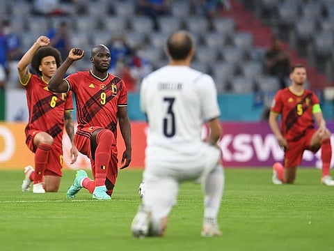 Euro 2020 - Quarter Final - Belgium v Italy - Football Arena Munich, Munich, Germany - July 2, 2021 Belgium's Romelu Lukaku and Axel Witsel take a knee before the match