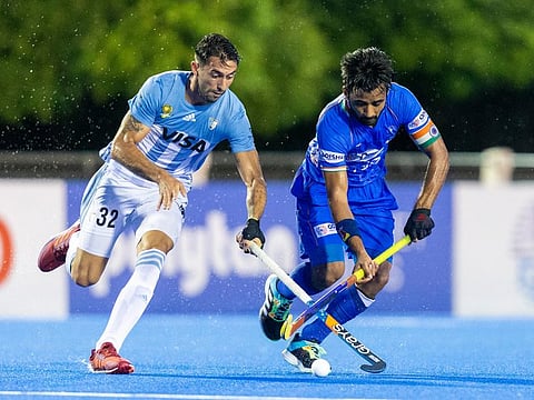 Indian hockey team captain Manpreet Singh (right) being challenged by an Argentine player during their FIH Pro League match in April.