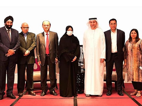 Dr Raja Esa Al Gurg and Dr Abdulkareem Al Olama with Indian community representatives at an event organised by the IBPC