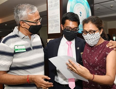Sidharth Hariharan, student and valedictorian, GEMS Modern Academy, with his parents as he scored a perfect 45 at the IB exams.