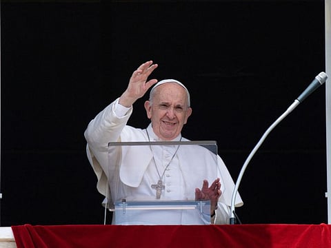 This handout picture taken and released by the Vatican Media on July 4, 2021 shows Pope Francis delivering the Sunday Angelus prayer from the window of his study overlooking St. Peter's Square at the Vatican.