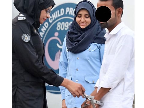 The harasser being arrested by woman police officer in Islamabad.