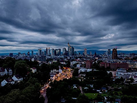 Dark clouds drift over the city of Frankfurt, Germany, late Monday, July 5, 2021.