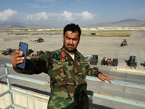 An Afghan soldier takes a selfie inside the Bagram air base after all US and Nato troops left, some 70km north of Kabul on July 5, 2021.