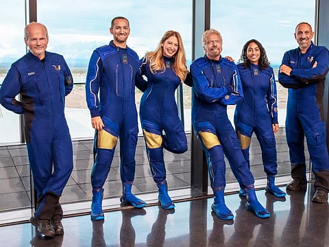From left: Chief Pilot Dave Mackay, Lead Operations Engineer Colin Bennett,  Chief Astronaut Instructor Beth Moses, Founder of Virgin Galactic Richard Branson, Vice President of Government Affairs and Research Operations Sirisha Bandla and pilot Michael Masucci. Branson is aiming to beat fellow billionaire Jeff Bezos into space by nine days.