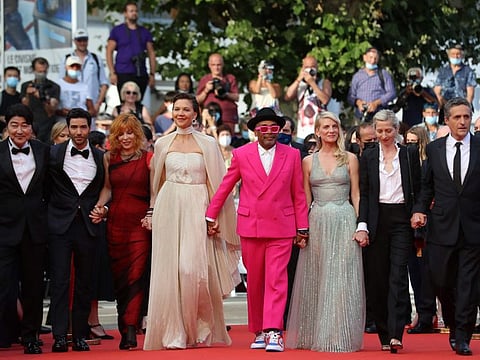 US director and Jury President of the 74th Cannes Film Festival Spike Lee (C) arrives with Jury members (from L) South Korean actor Song Kang-Ho, French actor Tahar Rahim, French-Canadian singer Mylene Farmer, US actress Maggie Gyllenhaal, French actress and director Melanie Laurent, Austrian director Jessica Hausner and Brazilian director Kleber Mendonca Filho for the opening ceremony and the screening of the film "Annette" at the 74th edition of the Cannes Film Festival in Cannes, southern France, on July 6, 2021.