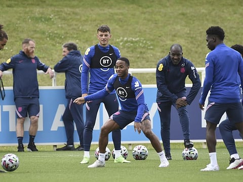 England's Raheem Sterling, centre, in action during a training session at St George's Park, Burton upon Trent, England, ahead of their Euro 2020 championship semifinal match against Denmark in London.