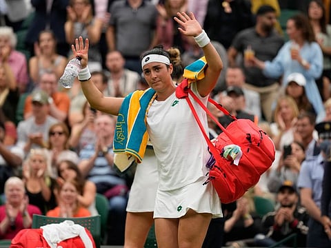 A crestfallen Ons Jabeur (facing camera) after her quarter final defeat to Arya Sabalenka in Wimbledon on Wednesday.