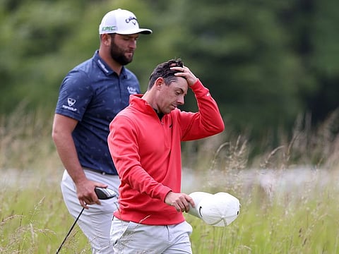 Northern Ireland's Rory McIlroy struggled at the Scottish Open, while Jon Rahm held the halfway lead