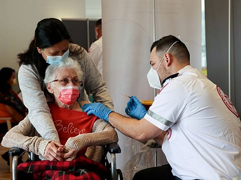 An elderly woman receives her vaccination at an assisted living facility, in Netanya, Israel, in a file photo.