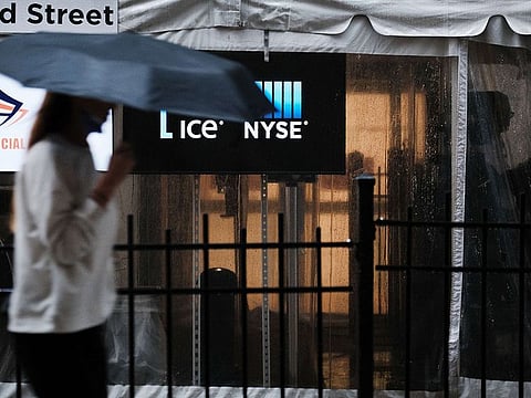 People walk by the Stock Exchange on July 08, 2021 in New York City.
