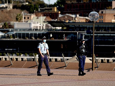 Police officers patrolling around the Opera House, as Sydney’s five million residents will be in COVID-19 lockdown for “at least” another two weeks, state premier Gladys Berejiklian announced on July 14.