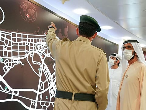 His Highness Sheikh Mohammed bin Rashid Al Maktoum being briefed during his visit to Dubai Police Headquarters today.