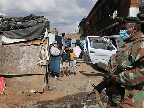 Members of the military patrol through the streets of Alexandra township as the country deploys the army to quell unrest linked to the jailing of former President Jacob Zuma, in Johannesburg, on July 15, 2021.