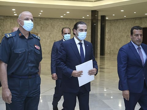 Lebanese Prime Minister-Designate Saad Hariri, centre, arrives to his meeting with Lebanese President Michel Aoun at the presidential palace, in Baabda, east of Beirut, Lebanon, on July 14, 2021. Hariri will again meet Aoun later today.