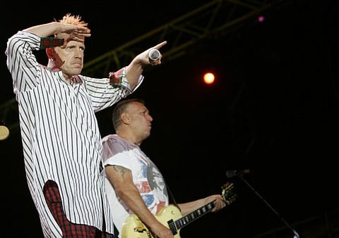 In this file photo dated Monday, July 14, 2008, John Lydon, left, and Steve Jones of British band the Sex Pistols perform during the Exit music festival in Novi Sad, Serbia. Former members of the Sex Pistols Guitarist Steve Jones and drummer Paul Cook, are suing singer Johnny Rotten for the right to use the band’s songs in an upcoming television series "Pistol" about the anarchic punk icons, based on a memoir by Jones.